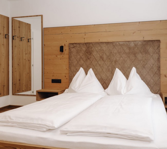 Gemütliche Betten im Doppelzimmer im 3 Sterne Hotel Garni Tannenhof im Salzburger Land